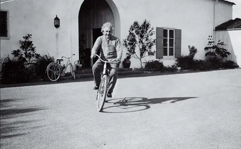 Albert Einstein, riding a bike