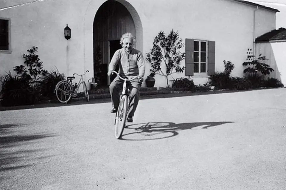 Albert Einstein, riding a bike