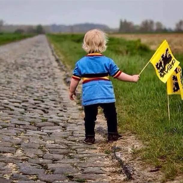 Passion for cycling - A child is waiting for the peloton.
