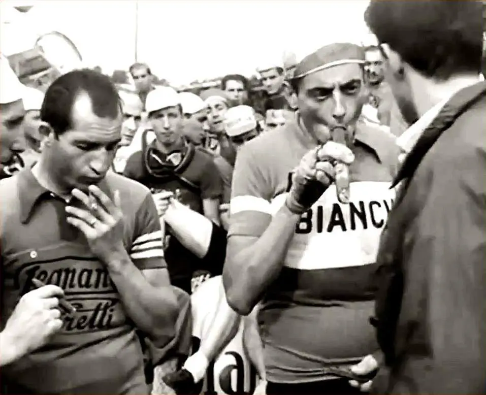 Fausto Coppi and Gino Bartali smoking cigars