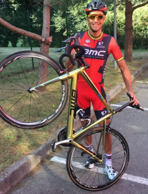 Greg Van Avermaet shows his golden painted BMC bike