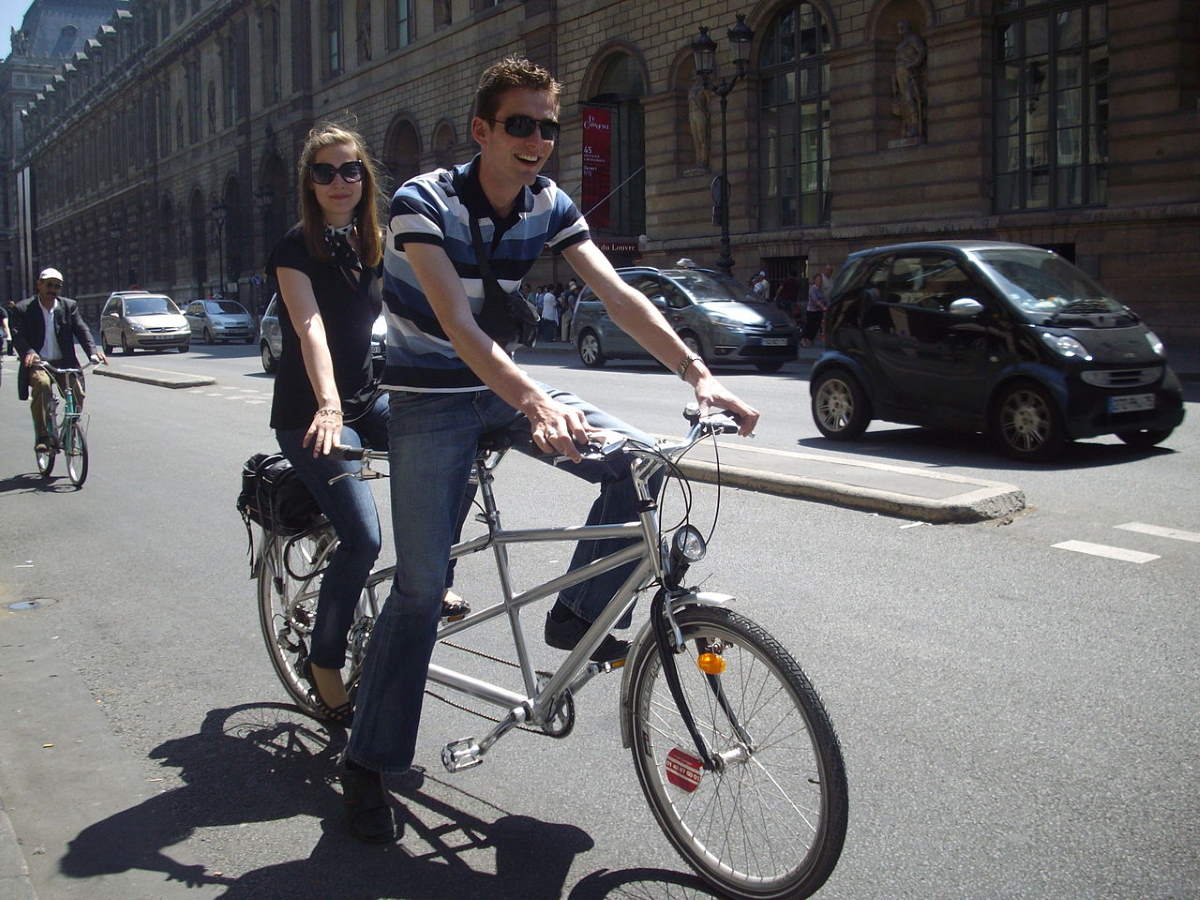 A Couple on a tandem bicycle in Paris