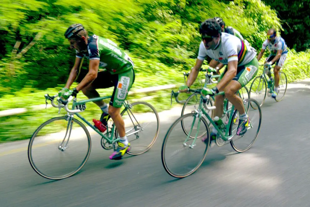 Antonio Santaromita and Gianni Bugno are both riding their green Gatorade-liveried Bianchi bikes during the 1992 Coppa Bernocchi